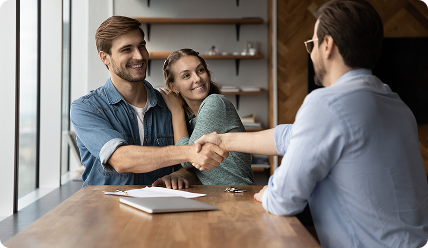 A business meeting discussing property documents.